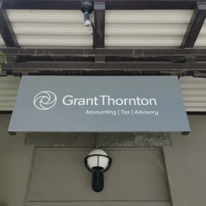 Black awning with white vinyl lettering for an accounting firm