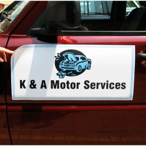 custom printed car magnet on the side door of a red car