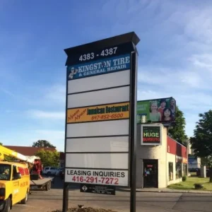pylon signage with spaces for businesses, some of them empty