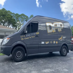 A work van with custom printed vinyl wrap