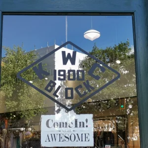 cut lettering on window of a door of a business