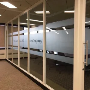 privacy window film on glass windows, with company name cut out